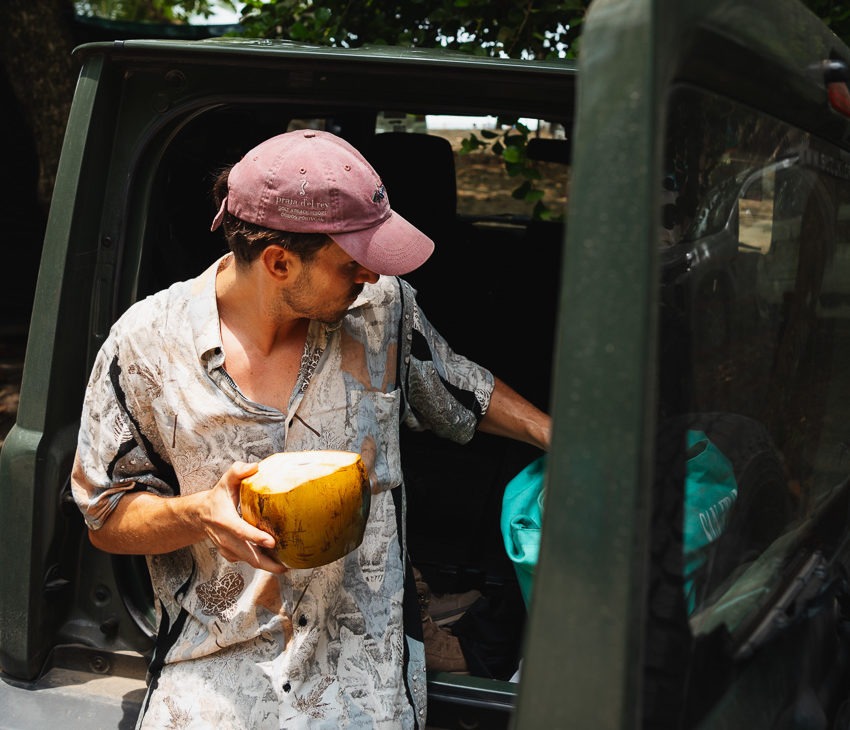 a man with a coconut