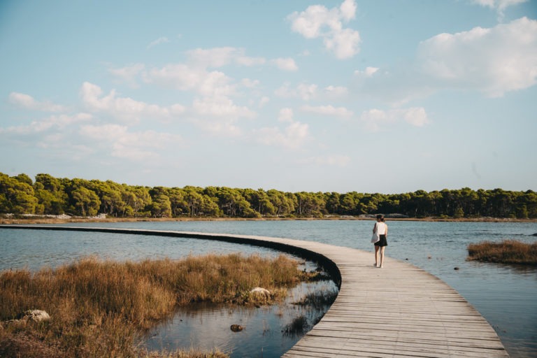 A joung woman on a pier