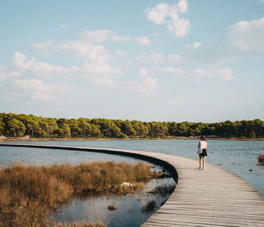 A joung woman on a pier