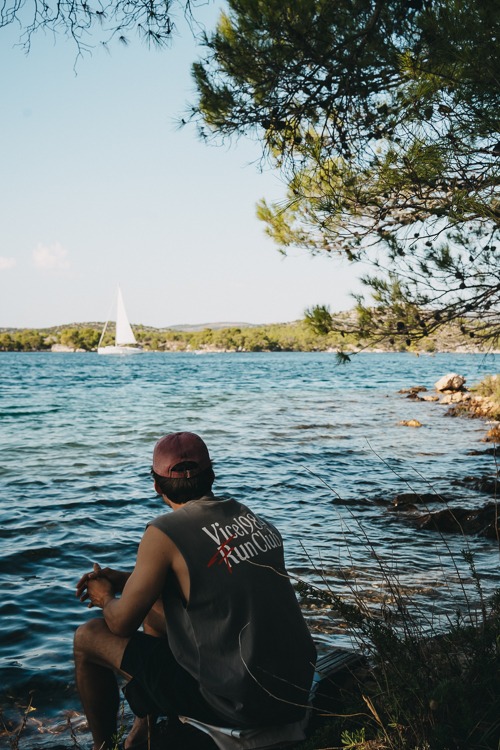 Young man at the St. Ante sea channel in Šibenik