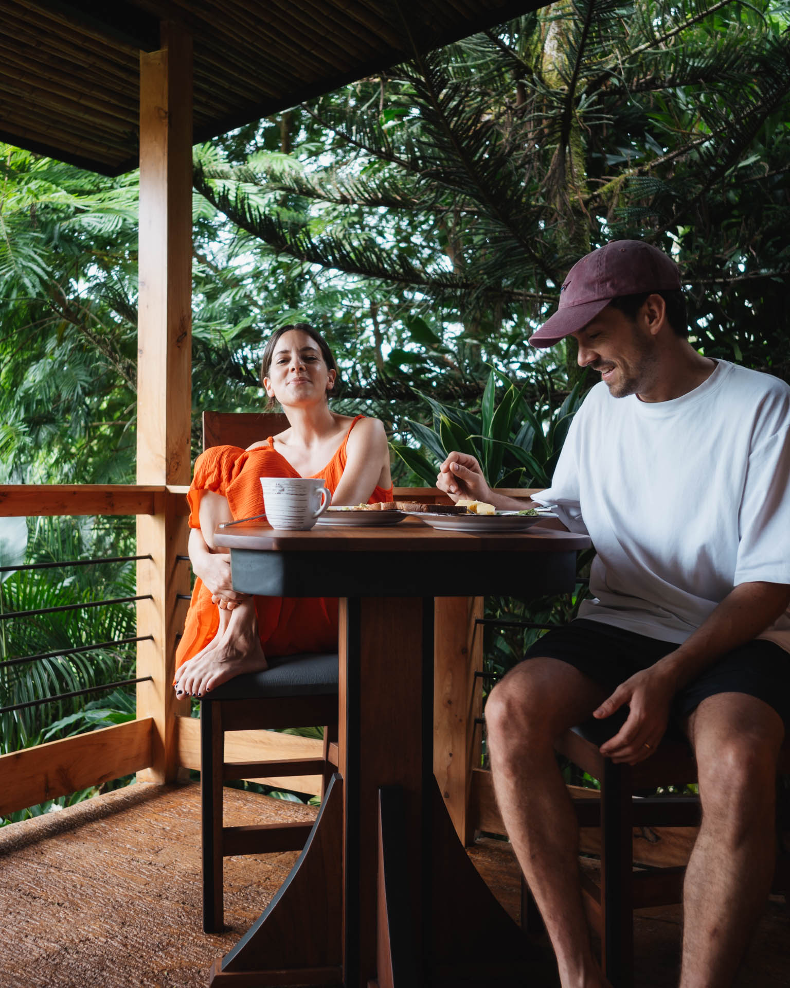 a couple sitting on a terrace