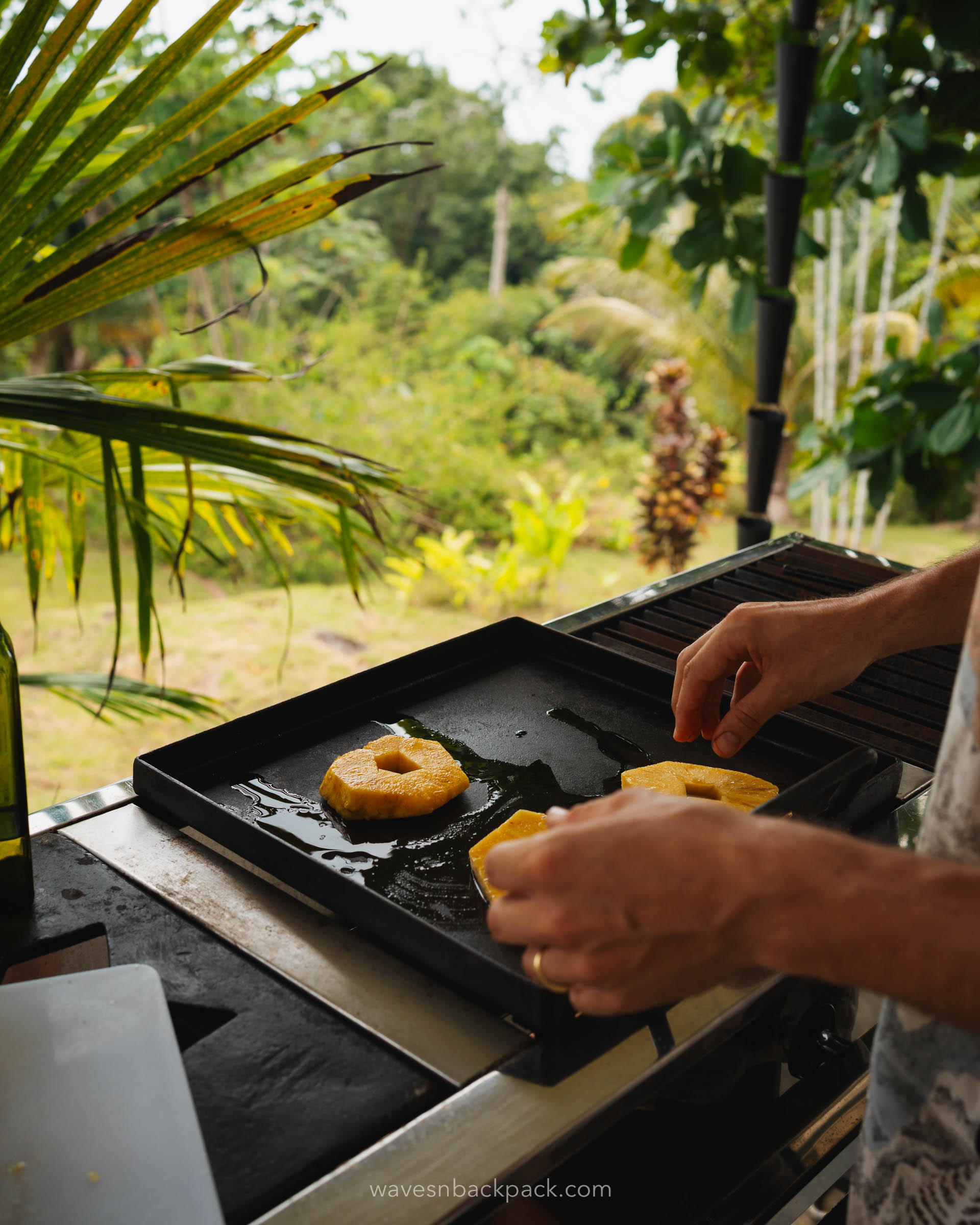 a man barbecues a pineapple